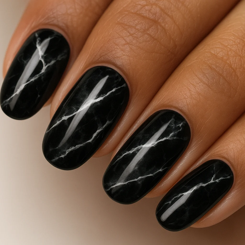 Black gloss nails with white marble vein pattern inverted black onyx effect on medium dark warm skin clean studio — marble black nail 2026