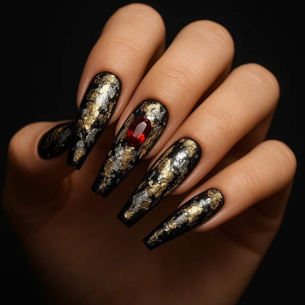 Refined maximalist nails with black base, mixed gold silver foil, and red gem on coffin — luxury nail art 2026