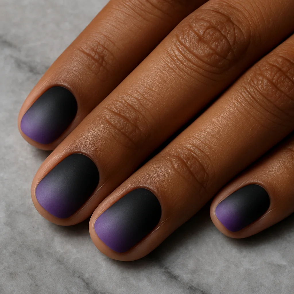 Short round nails in asexual Pride flag black grey white and purple graduated gradient on warm brown skin on grey marble — ace pride nail 2026